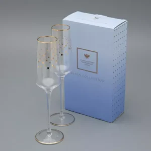 Golden Azur wine and champagne glasses with cascading gold stars and matching stem trim, elegant and festive tableware
