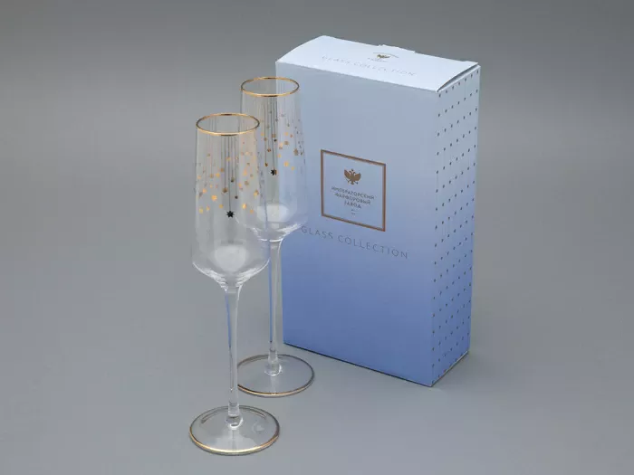 Golden Azur wine and champagne glasses with cascading gold stars and matching stem trim, elegant and festive tableware